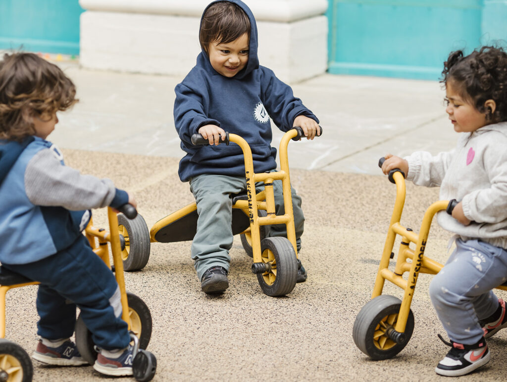 preschool children on 3-wheel bikes